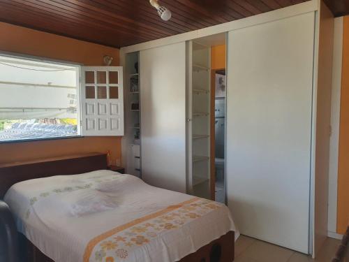 Postel nebo postele na pokoji v ubytování Litoral Norte Jacuípe Guarajuba