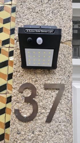 a sign for a solar smart sensor unit on a counter at Rooms4you 1 in historic center of Braga in Braga