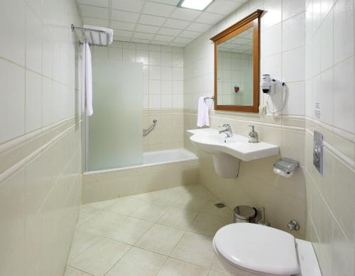 a bathroom with a toilet and a sink and a shower at Julian Forest Suites in Marmaris