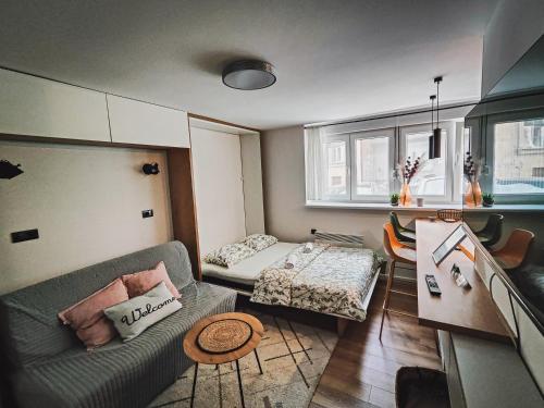 a living room with a couch and a table at Teka’s home in Sarajevo