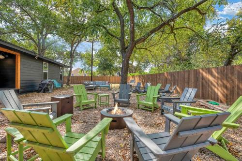 a group of lawn chairs sitting around a fire pit at New-The Mod Poppy Large home 10 minutes from it all in Waco