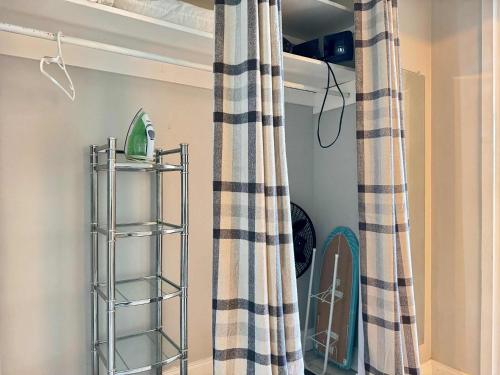 a shelf in a room with a curtain at Atlanta Downtown! High Rise! Onsite Parking LM609 in Atlanta