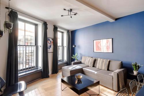 a living room with a couch and a table at Chic 1-Bed Apartment near Covent Garden Piazza in London