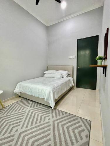 Postel nebo postele na pokoji v ubytování Ruma10 Homestay