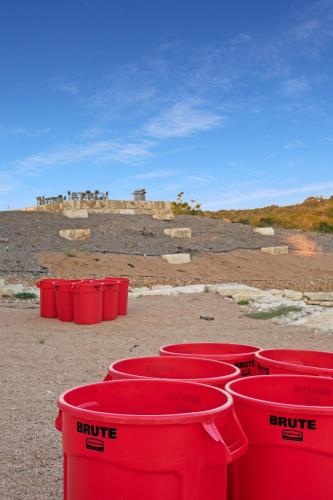 a group of red barrels sitting on the ground at Starlight Horizon Cabin M - Pet-Friendly Texas Hill Country Cabin Near Canyon Lake - Pool, Stargazing & Group Getaways - Sleeps 8 in Canyon Lake