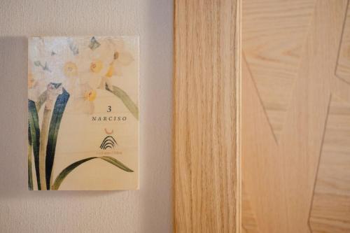 a picture of a flower on a wall at La Caso Di Elva in Elva