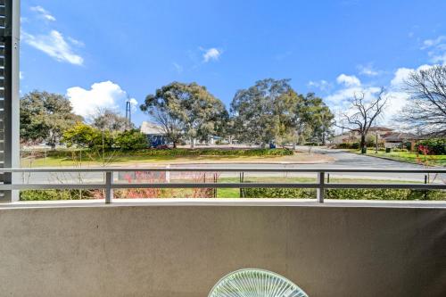 a balcony with a view of a park at Tranquil Apartment in Green, Well Connected Suburb in Lyons