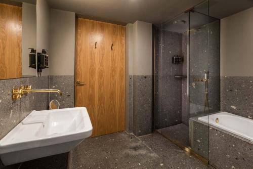a bathroom with a sink and a shower at Eurostars Santa Luzia in Guimarães