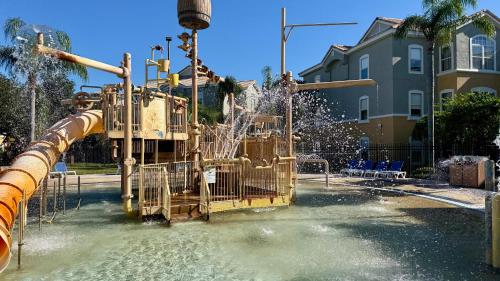 a water park with a slide in the water at Holiday Inn Express & Suites Clermont SE - West Orlando by IHG in Orlando
