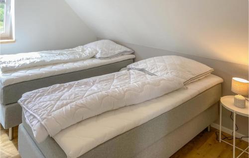 two beds sitting next to each other in a room at Stunning Home In Timmernabben With Wifi in Timmernabben