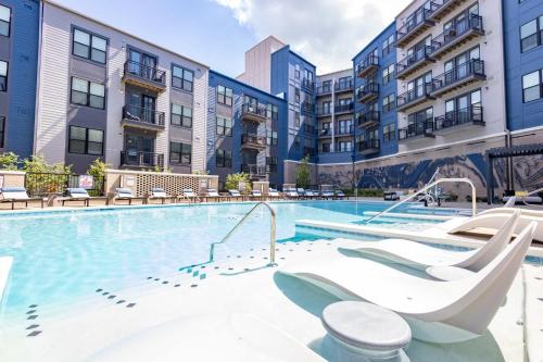 a swimming pool with a slide in a apartment complex at Charming 1BR 1BA Apartment Near Downtown Cincinnati in Cincinnati