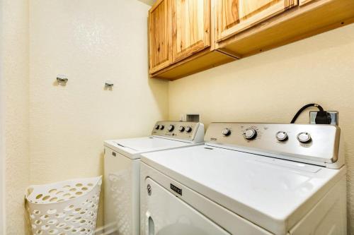 a laundry room with a washer and dryer at Breathtaking Island Views from Multiple Decks! in Surfside Beach