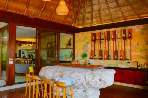 a room with a large table and some chairs at Lipsos Private Luxury Beachfront home in Progreso