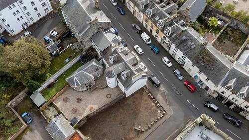 an overhead view of a city street with cars parked at Castle Street Apartments - Luxury Ettrick Apartment in Rothesay