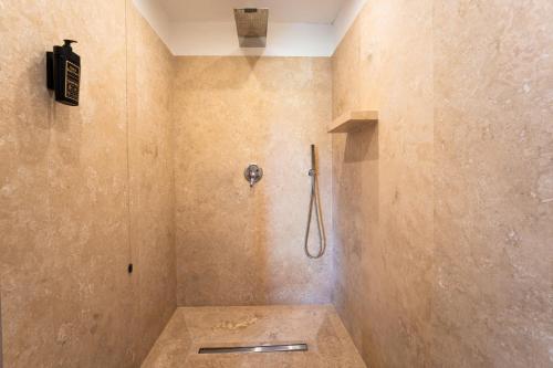 a bathroom with a shower with a toilet at Borgo San Luigi in Monteriggioni