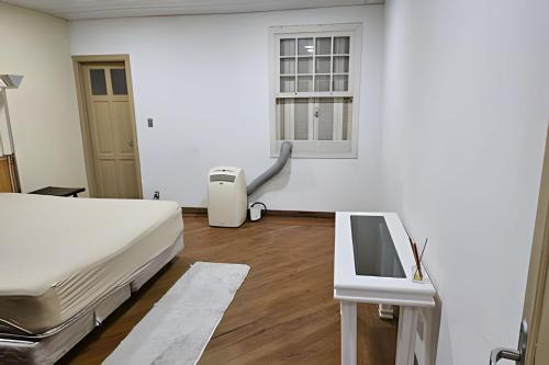 Postel nebo postele na pokoji v ubytování Casa Vergueiro