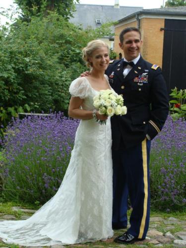 a bride and groom posing for a picture at Andelen Guesthouse in Ærøskøbing