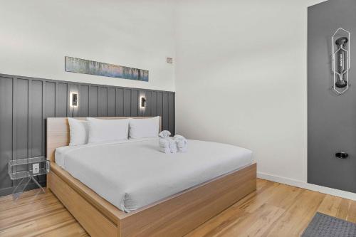 a bedroom with a large bed with two teddy bears on it at Freshly Remodeled - 2 King Beds- Breathtaking Views in Canmore