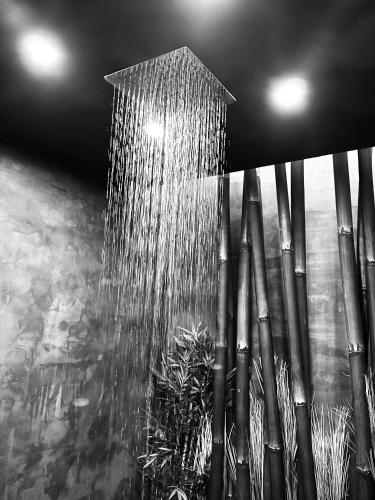 a shower with water coming out of it at Villa Anna Splendid Sunset Ocean Front in Mosteiros