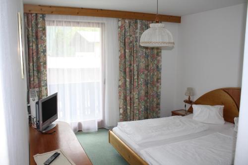 Postel nebo postele na pokoji v ubytování Hotel Hubertus