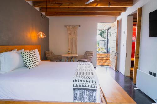 Postel nebo postele na pokoji v ubytování Casa Chichipicas Hotel Boutique