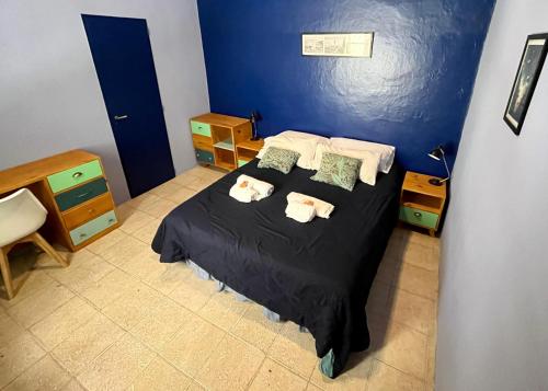 Ένα ή περισσότερα κρεβάτια σε δωμάτιο στο Sabatico Travelers Hostel & Guesthouse