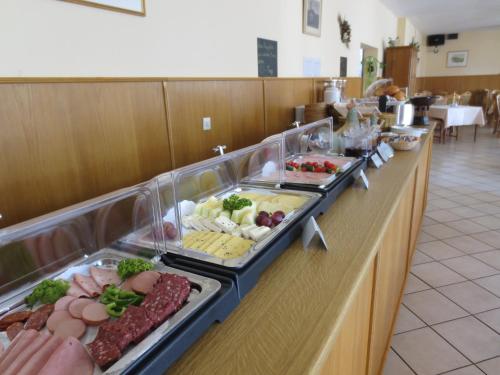 a buffet line with many different types of food at Hotel Krone in Bad Münster am Stein-Ebernburg