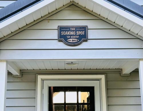 a sign on the front of a house at Beautiful Retreat on Sand Lake in Irons