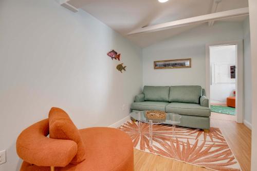 a living room with a couch and a chair at New The Cottage at James House in Key West