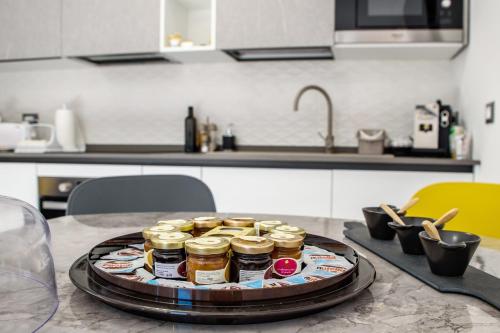 a tray of jars on a table in a kitchen at Locazione Turistica Arcobaleno "Appartamento Deluxe" in Roccavivara
