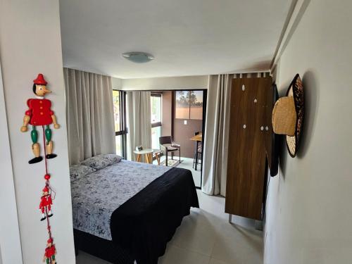 En eller flere senge i et værelse på FLAT PÉ NA AREIA Carneiros Tamandaré