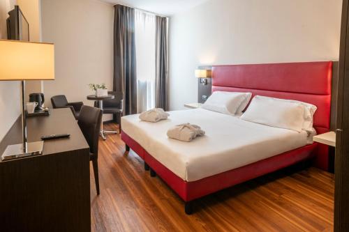 Postel nebo postele na pokoji v ubytování Kona Hotel Verona by Kleos Group Collection