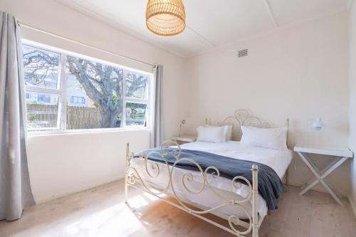 Ένα ή περισσότερα κρεβάτια σε δωμάτιο στο Coastal Elegant 4 Bedroom Home