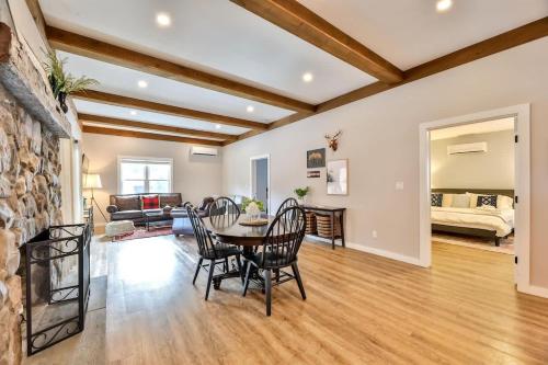 a living room with a table and chairs at Mountain Cabin with Scenic Views and Hot Tub in Windham