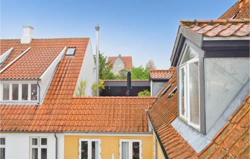 a group of buildings with orange roofs at Apartment Nytorv in Ebeltoft