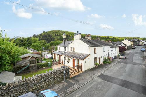 an aerial view of a small village with houses and a street at Bens Row Cottage, The Lake District in Backbarrow