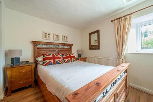 En eller flere senge i et værelse på Bens Row Cottage, The Lake District