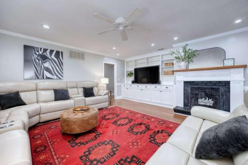 a living room with a couch and a fireplace at Near Botanical Garden with a Pool Charming on Charing in Columbus