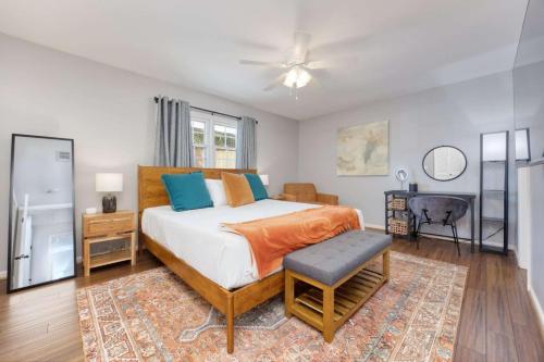 a bedroom with a king sized bed and a table at Near Botanical Garden with a Pool Charming on Charing in Columbus