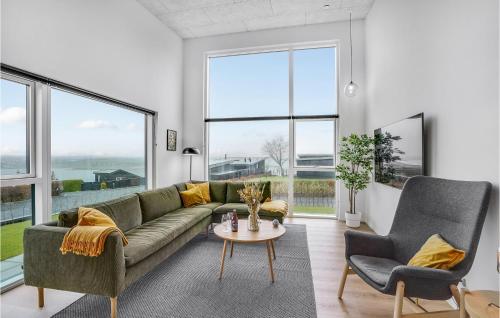 a living room with a couch and two chairs and a table at Lovely Home In Løgstrup With Wifi in Løgstrup