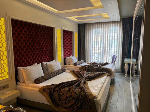 Кровать или кровати в номере Hotel Zade