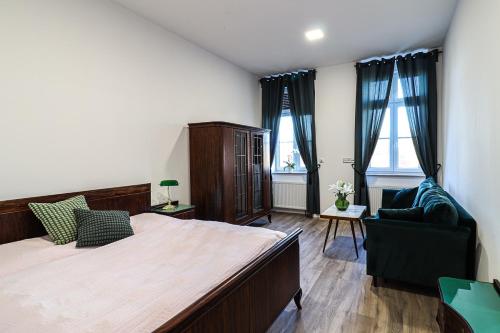 Postel nebo postele na pokoji v ubytování Penzion U HLAVÁČKŮ