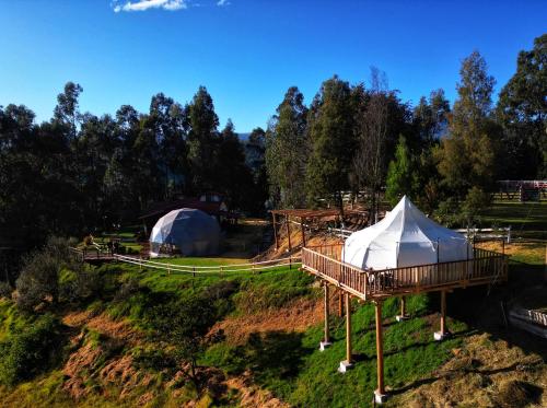 an aerial view of a yurt and a tent at Posada La Ollita Luxe Glamp in Sangolquí