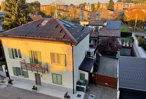 an overhead view of a house with solar panels on its roof at Green Stay Bergamo in Bergamo