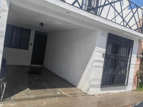 a building with a door with a metal gate at Monoambiente in San Luis Potosí