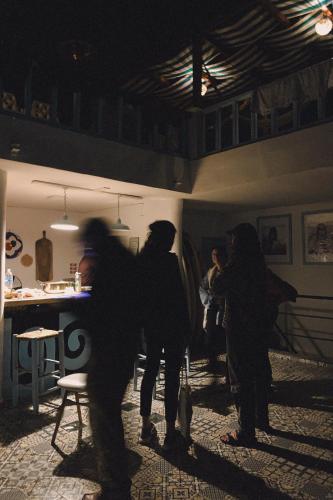 a group of people standing in a room at El MOJA SURFHOUSE in Sidi Ifni