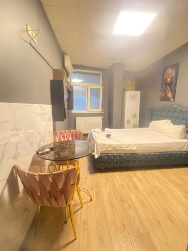Ένα ή περισσότερα κρεβάτια σε δωμάτιο στο Arena Apart Hotel