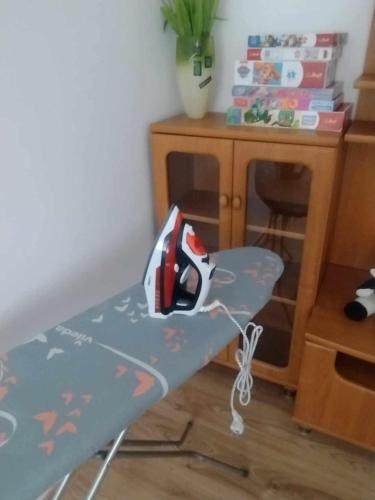 a table with a skateboard on it in a room at Apartament Komfort in Przemyśl