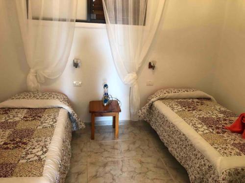 En eller flere senge i et værelse på Parque Santiago 2 2 bedroom 3 bathroom duplex