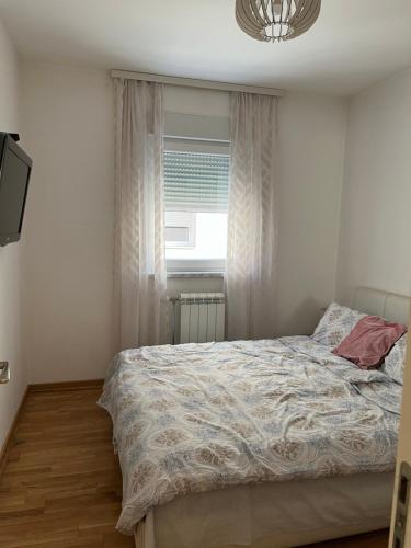 Ένα ή περισσότερα κρεβάτια σε δωμάτιο στο Apartment Leonis